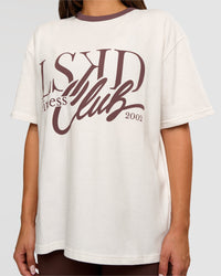 Woman wearing LSKD Fitness Club Heavyweight Oversized Tee - Off White-Cocoa Powder | Model:Bianca | Size:S