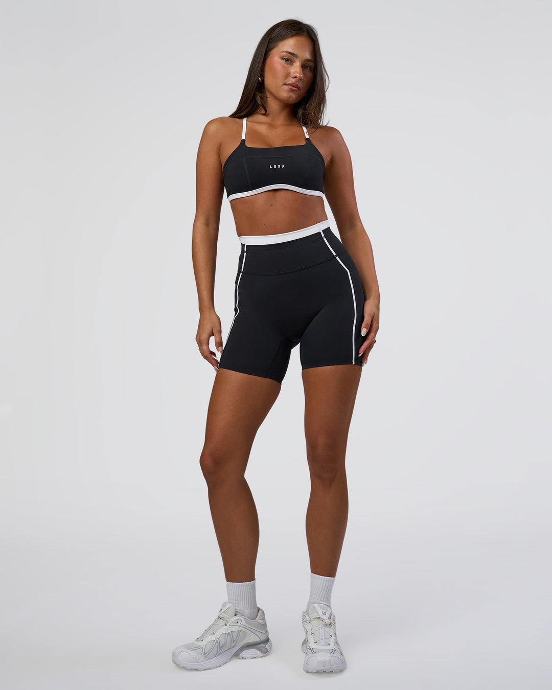 Woman wearing Liberate Contrast High-Rise 6&quot; Short Pockets - Black-White | Model:Bianca | Size:S