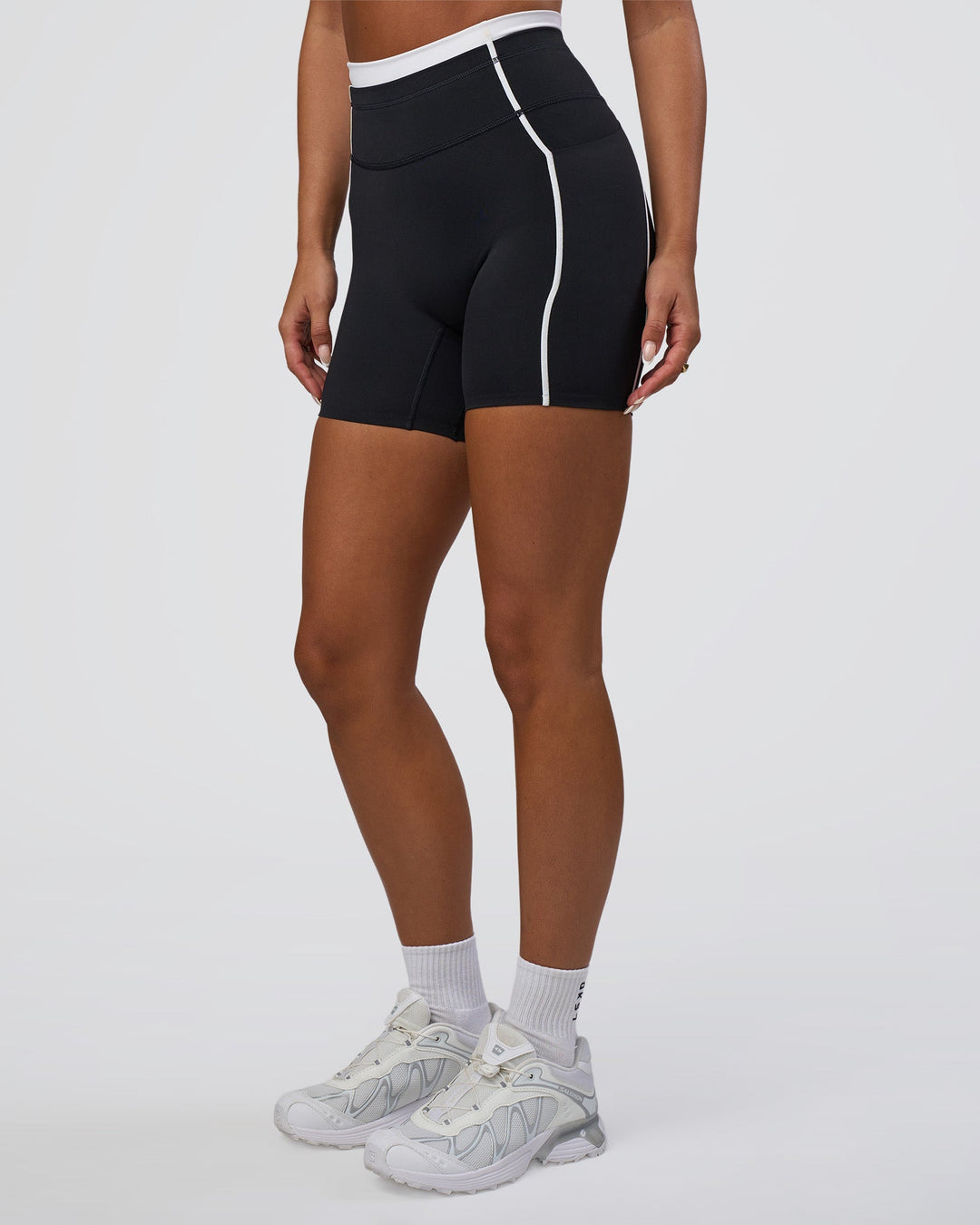 Woman wearing Liberate Contrast High-Rise 6&quot; Short Pockets - Black-White | Model:Bianca | Size:S