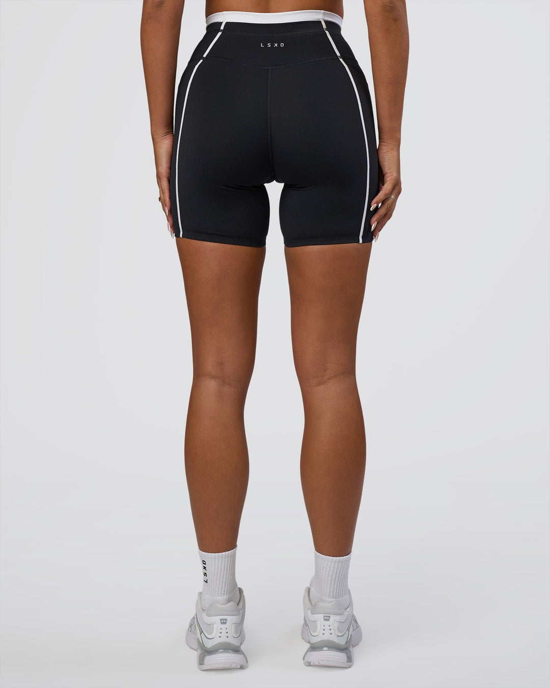 Woman wearing Liberate Contrast High-Rise 6&quot; Short Pockets - Black-White | Model:Bianca | Size:S