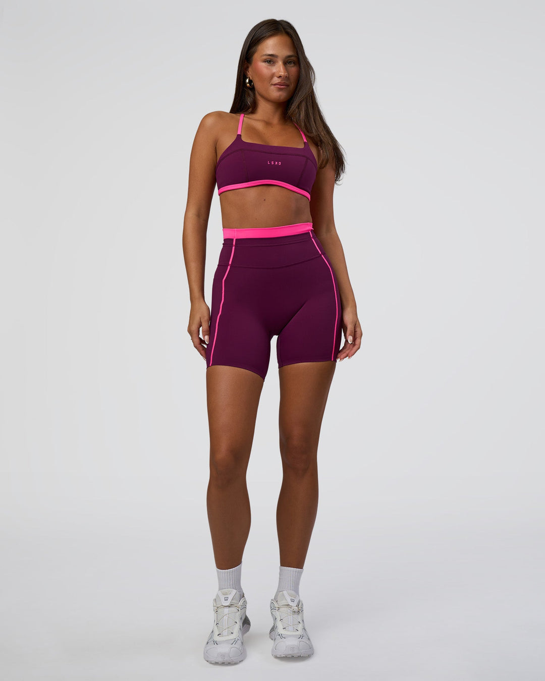 Woman wearing Liberate Contrast High-Rise 6&quot; Short Pockets - Plum Caspia-Ultra Pink | Model:Bianca | Size:S