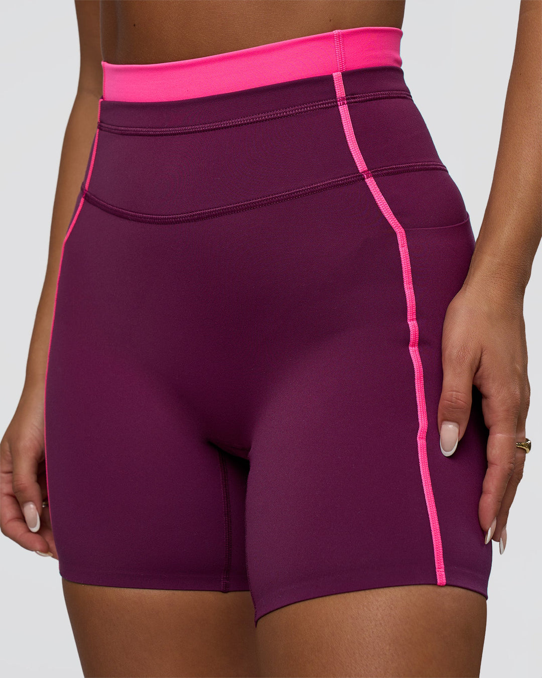 Woman wearing Liberate Contrast High-Rise 6&quot; Short Pockets - Plum Caspia-Ultra Pink | Model:Bianca | Size:S