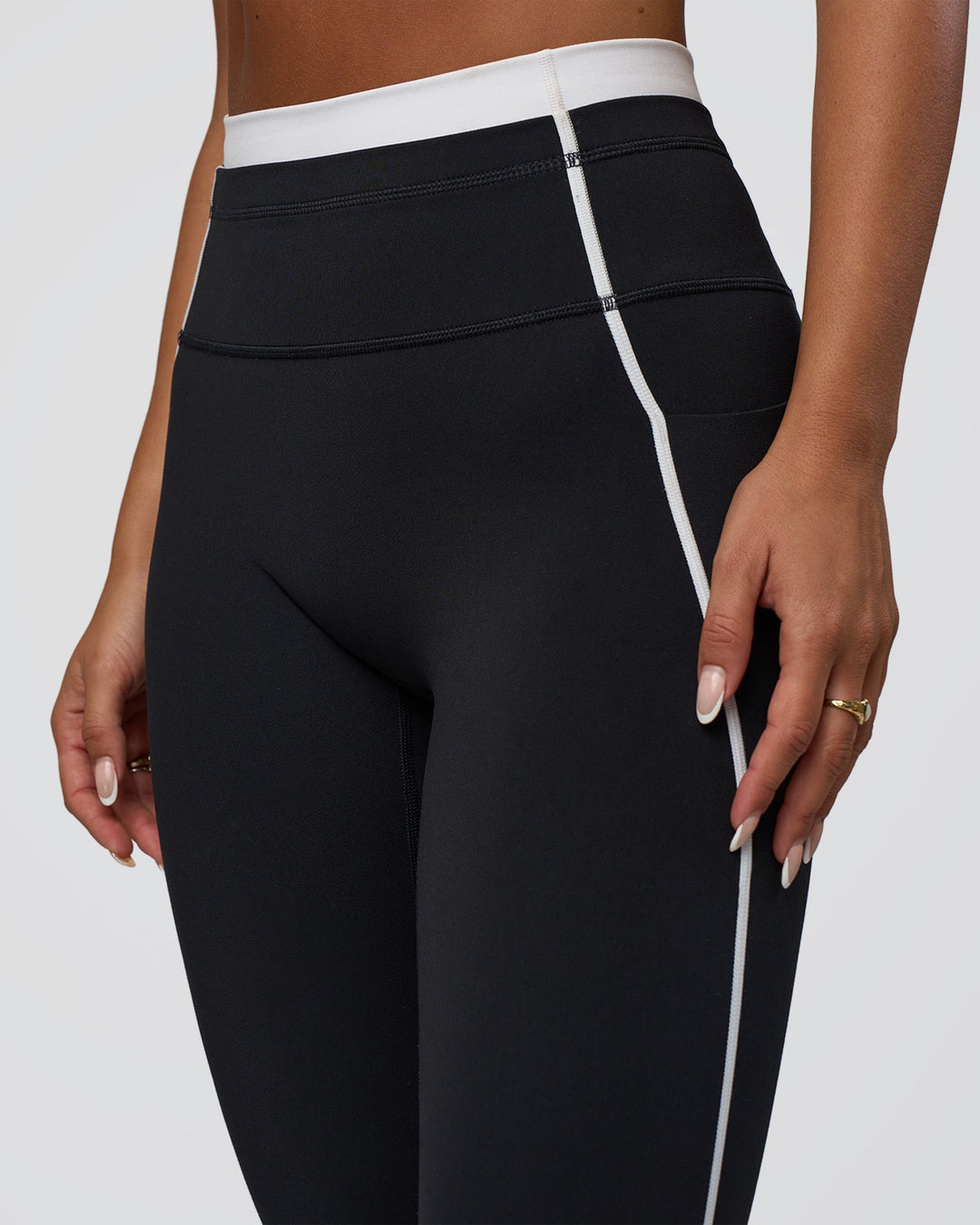 Woman wearing Liberate Contrast High-Rise Full Length Legging Pockets - Black-White | Model:Bianca | Size:S