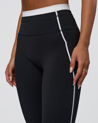 Woman wearing Liberate Contrast High-Rise Full Length Legging Pockets - Black-White | Model:Bianca | Size:S
