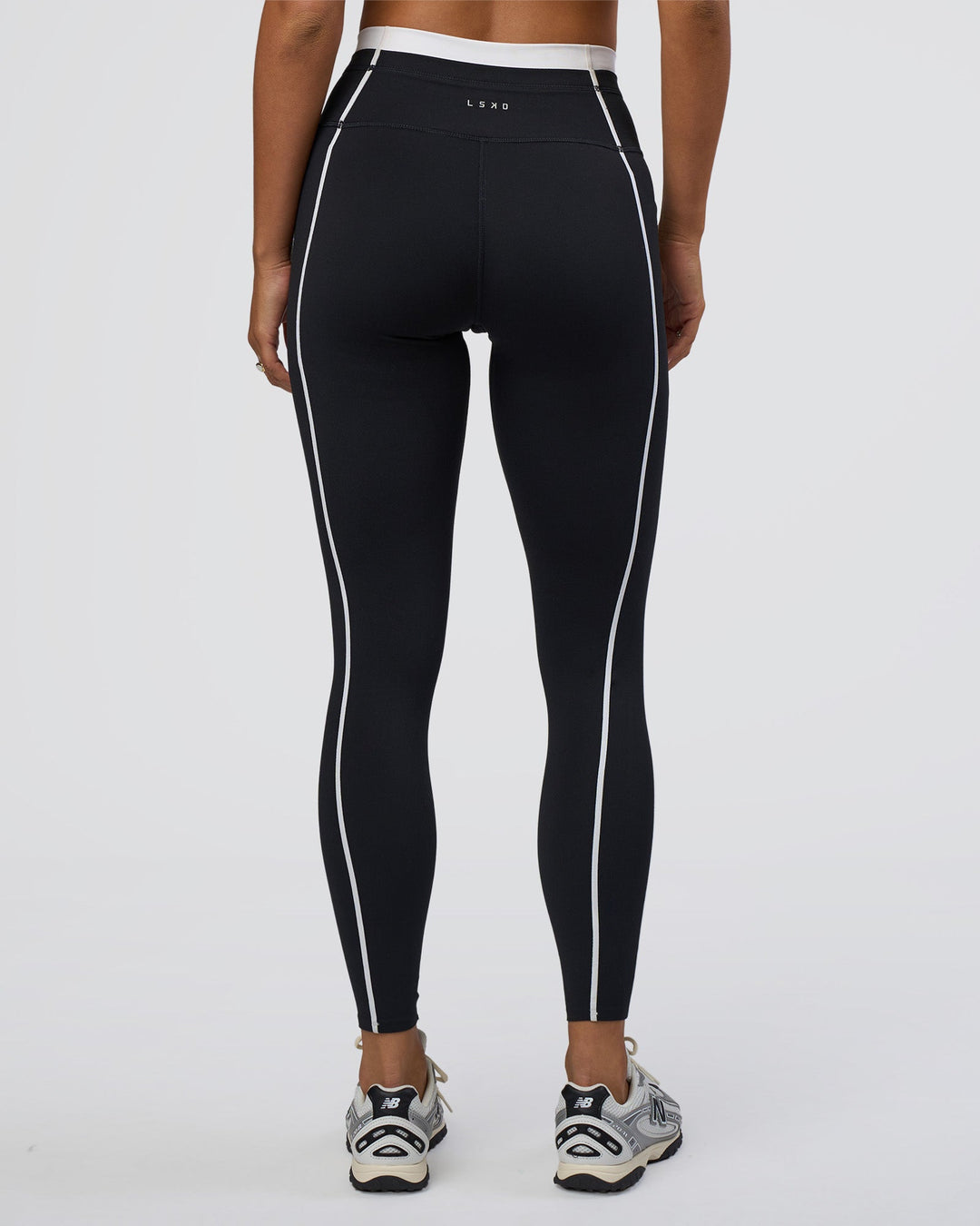 Woman wearing Liberate Contrast High-Rise Full Length Legging Pockets - Black-White | Model:Bianca | Size:S