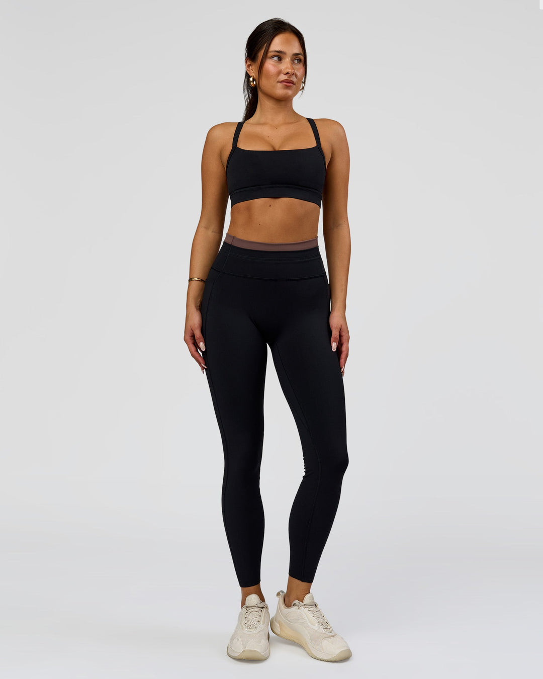 Woman wearing Liberate High-Rise Full Length Legging Pockets in Black-Cocoa Powder | Model:Bianca | Size:S - view 3