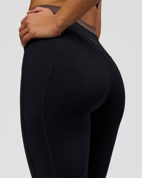 Woman wearing Liberate High-Rise Full Length Legging Pockets in Black-Cocoa Powder | Model:Bianca | Size:S | Thumbnail Index: 7