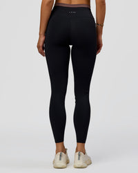 Woman wearing Liberate High-Rise Full Length Legging Pockets in Black-Cocoa Powder | Model:Bianca | Size:S | Thumbnail Index: 8