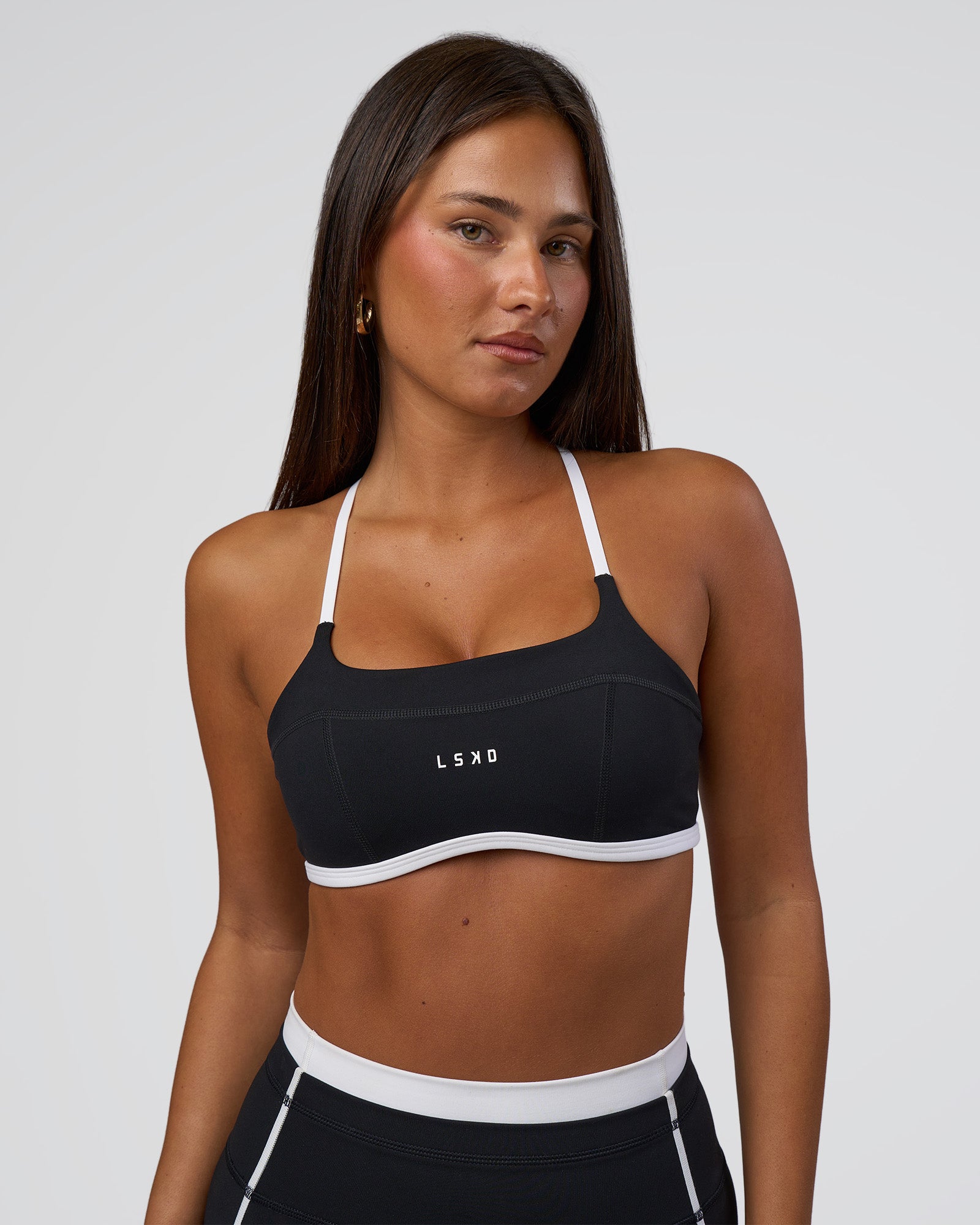 Woman wearing Liberate Sports Bra - Black-White | Model:Bianca | Size:S