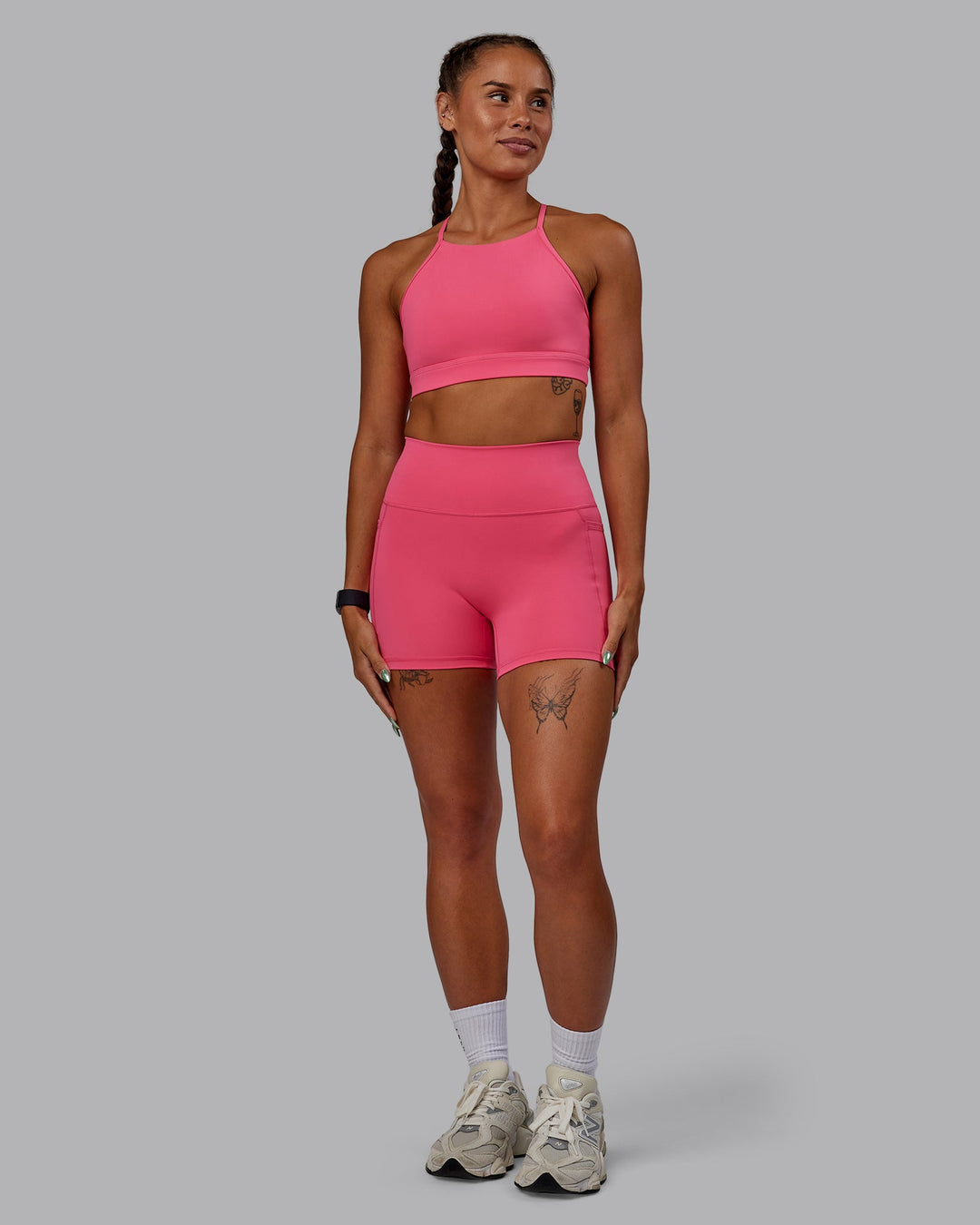 Woman wearing Lift High Neck Sports Bra - Hot Pink
