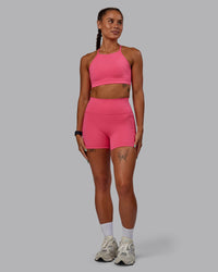 Woman wearing Lift High Neck Sports Bra - Hot Pink