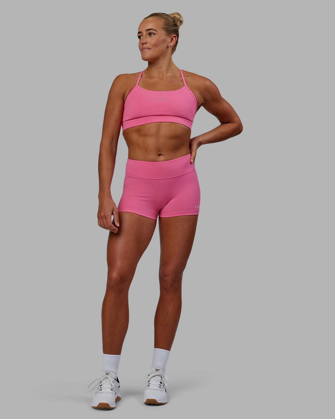 Woman wearing Lift Sports Bra - Carmine Rose