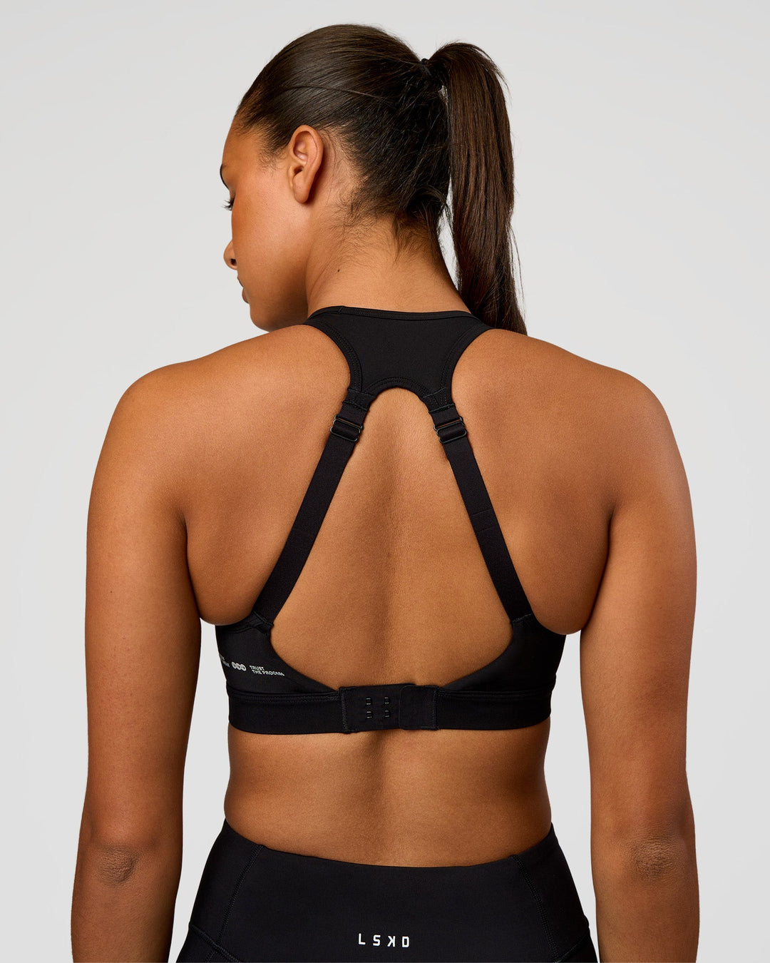 Woman wearing LimitLift Sports Bra - Black | Model:Rosie | Size:S - view 2