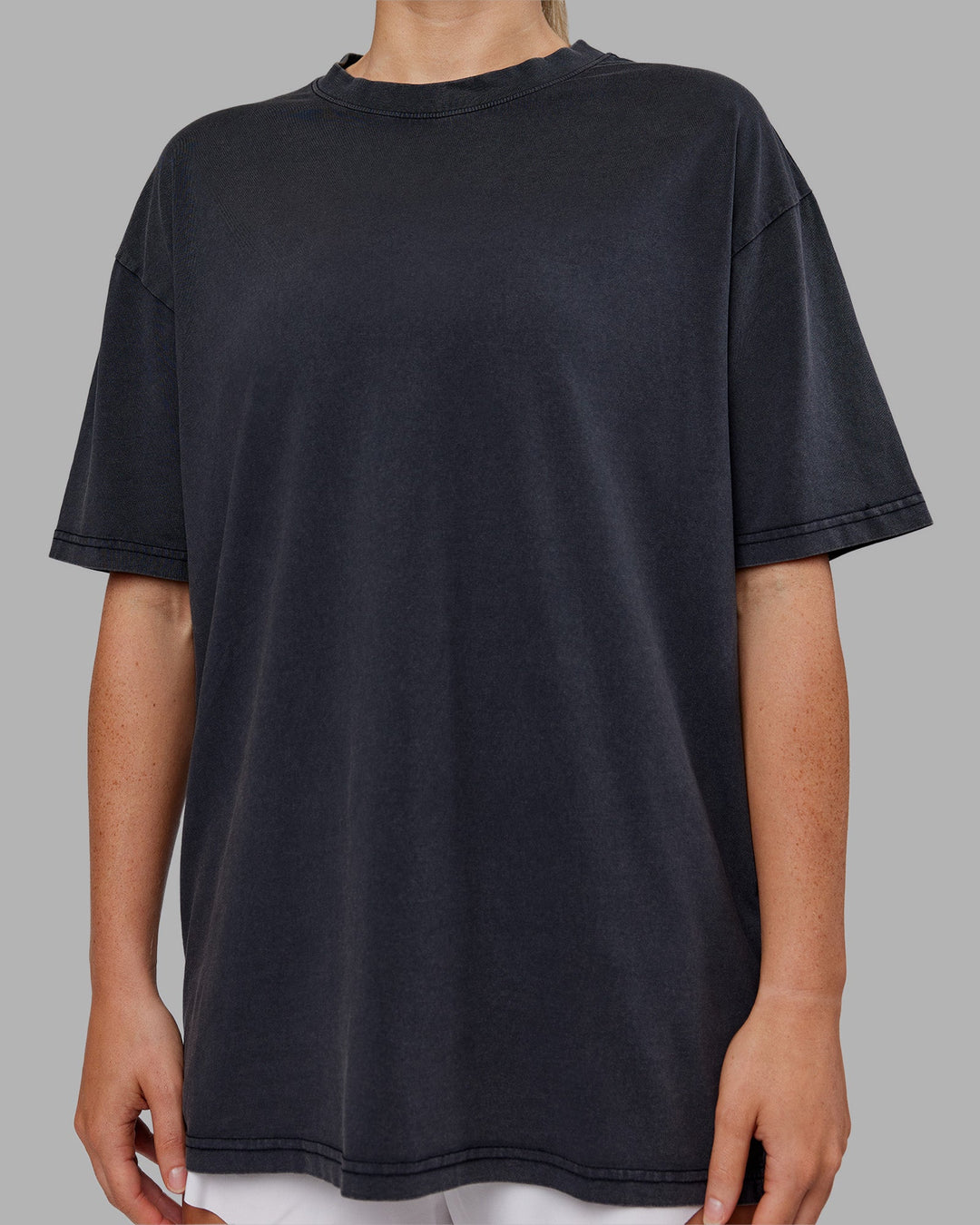 Woman wearing Love The Run FLXCotton Tee Oversize - Black Washed-Circular Grey | Model:Neve | Size:S