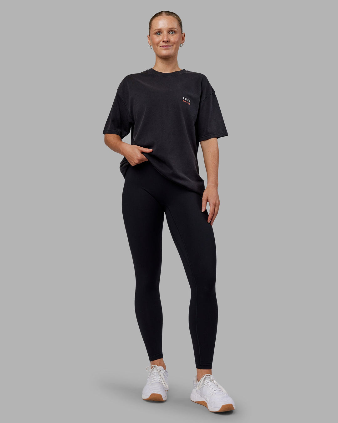 Woman wearing Love this S**t Washed Heavyweight Oversized Tee - Washed Black-Ultra Orange | Model:Neve | Size:S