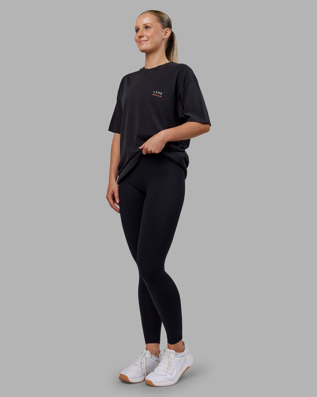 Woman wearing Love this S**t Washed Heavyweight Oversized Tee - Washed Black-Ultra Orange | Model:Neve | Size:S
