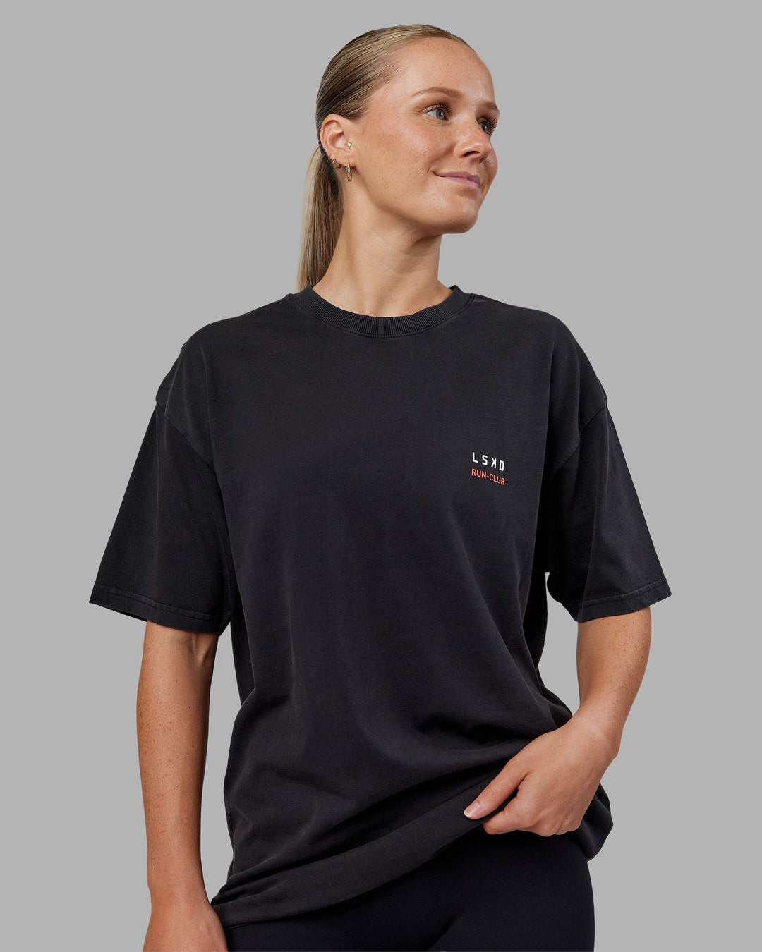 Woman wearing Love this S**t Washed Heavyweight Oversized Tee - Washed Black-Ultra Orange | Model:Neve | Size:S