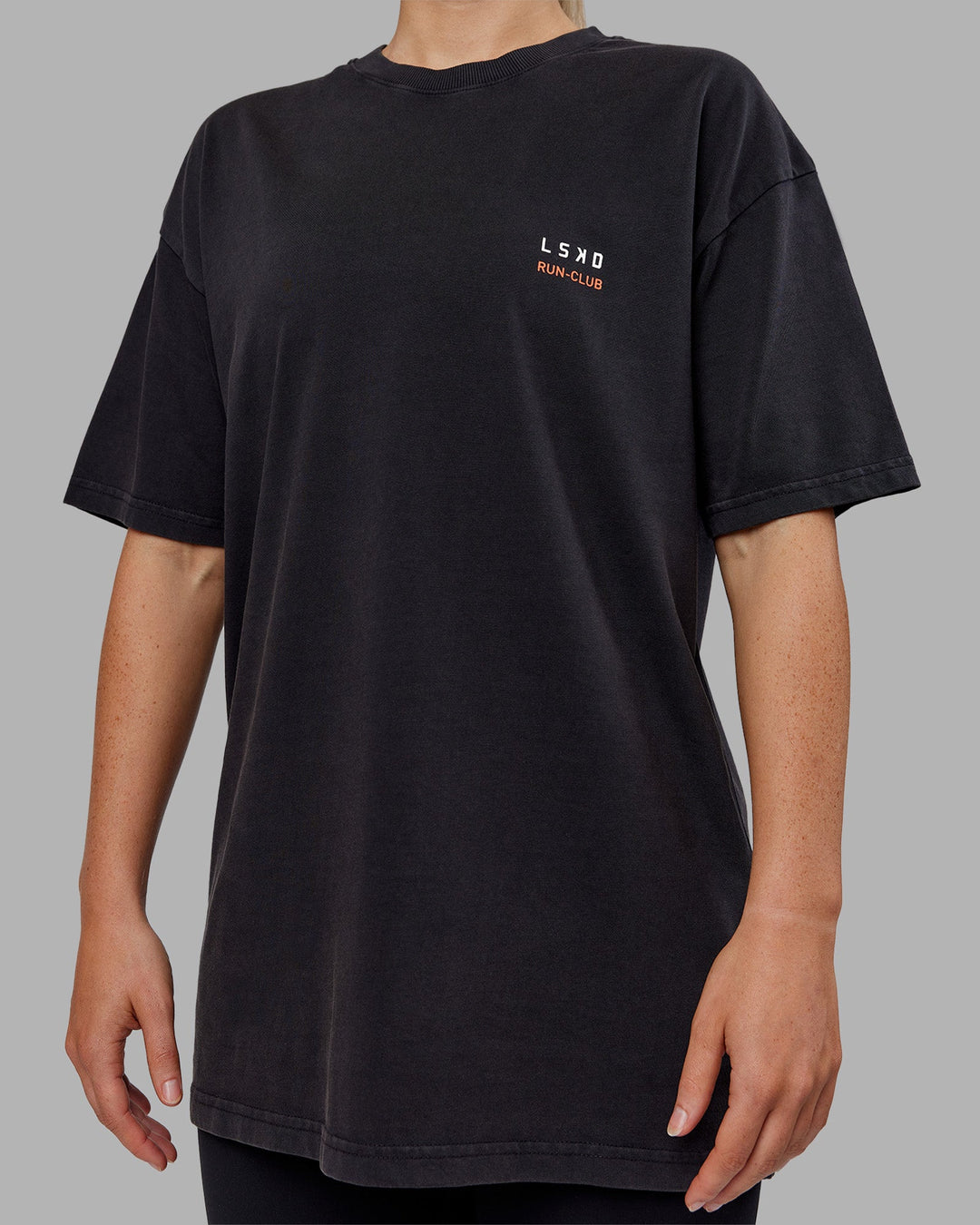 Woman wearing Love this S**t Washed Heavyweight Oversized Tee - Washed Black-Ultra Orange | Model:Neve | Size:S