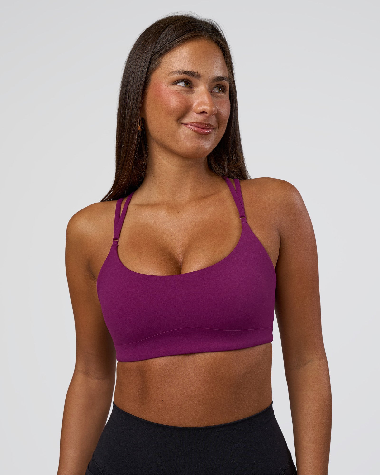 Woman wearing Luminate Sports Bra - Plum Caspia | Model:Bianca | Size:S