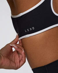 Woman wearing Luminous Sports Bra - Black-White | Model:Bianca | Size:S