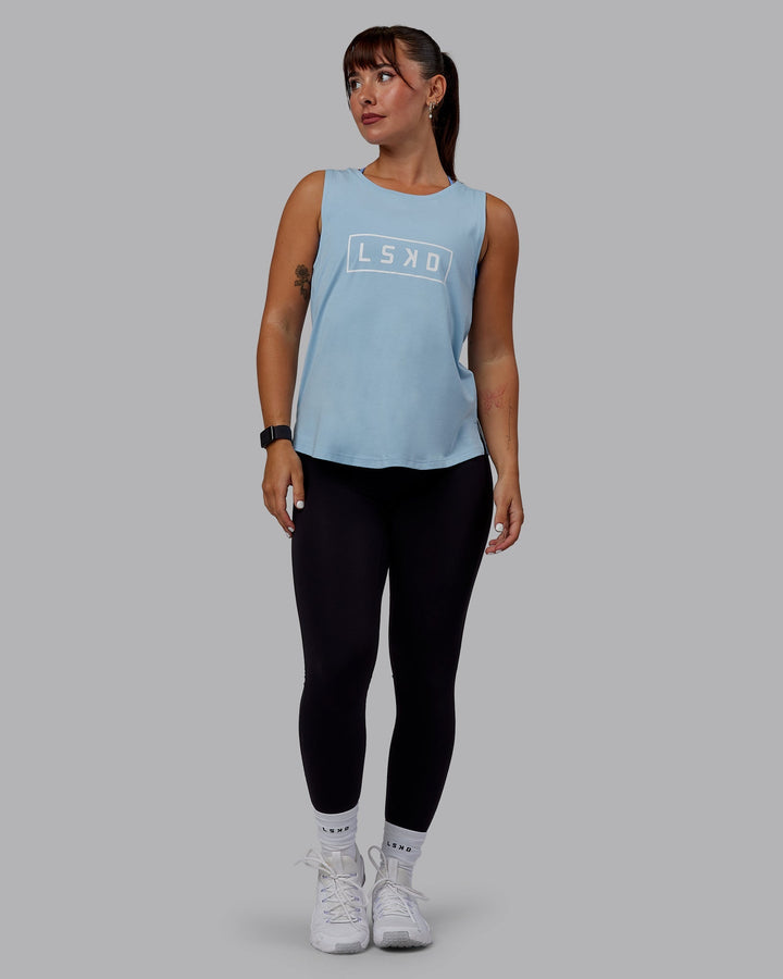 Woman wearing Luna FLXCotton Longline Tank - Glacial Blue-White
