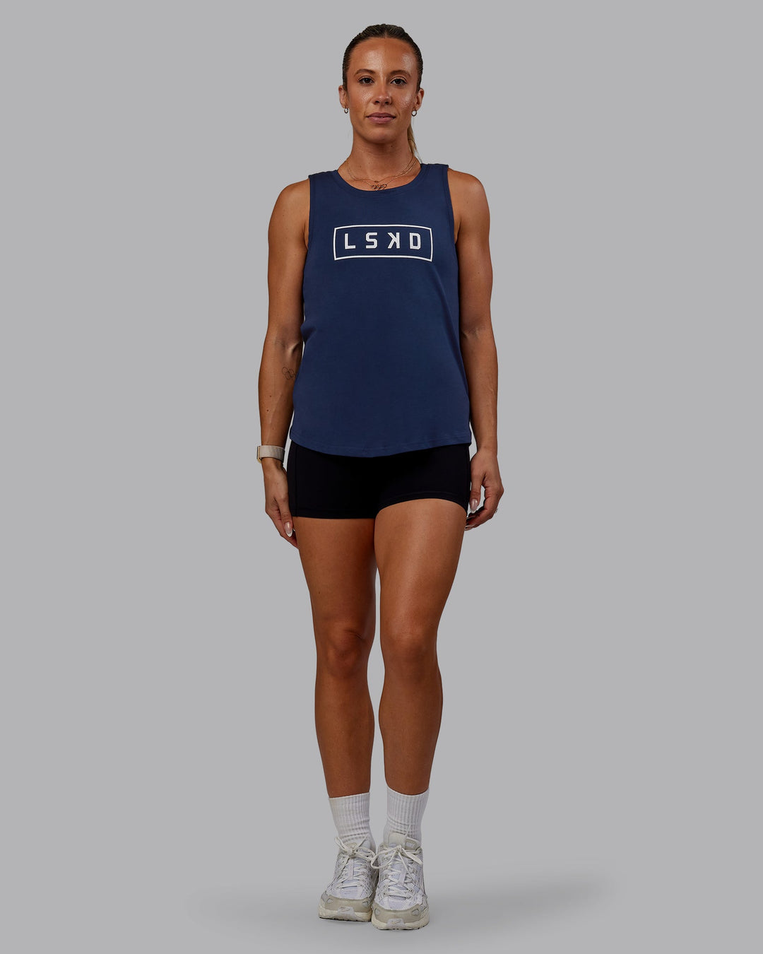 Woman wearing Luna FLXCotton Longline Tank - Future Navy-White