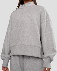 Woman wearing MVP 1/2 Zip Oversized Sweater - Light Grey Marl | Model:Brylee | Size:S