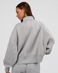 Woman wearing MVP 1/2 Zip Oversized Sweater - Light Grey Marl | Model:Brylee | Size:S