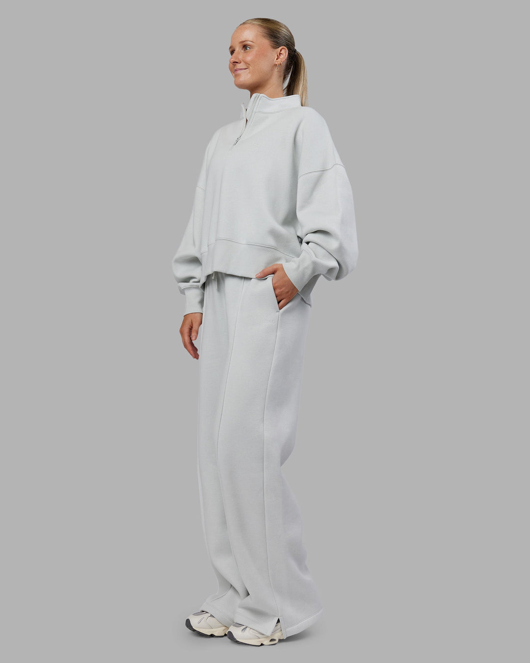 Woman wearing MVP 1/2 Zip Oversized Sweater - Digital Mist | Model:Neve | Size:S