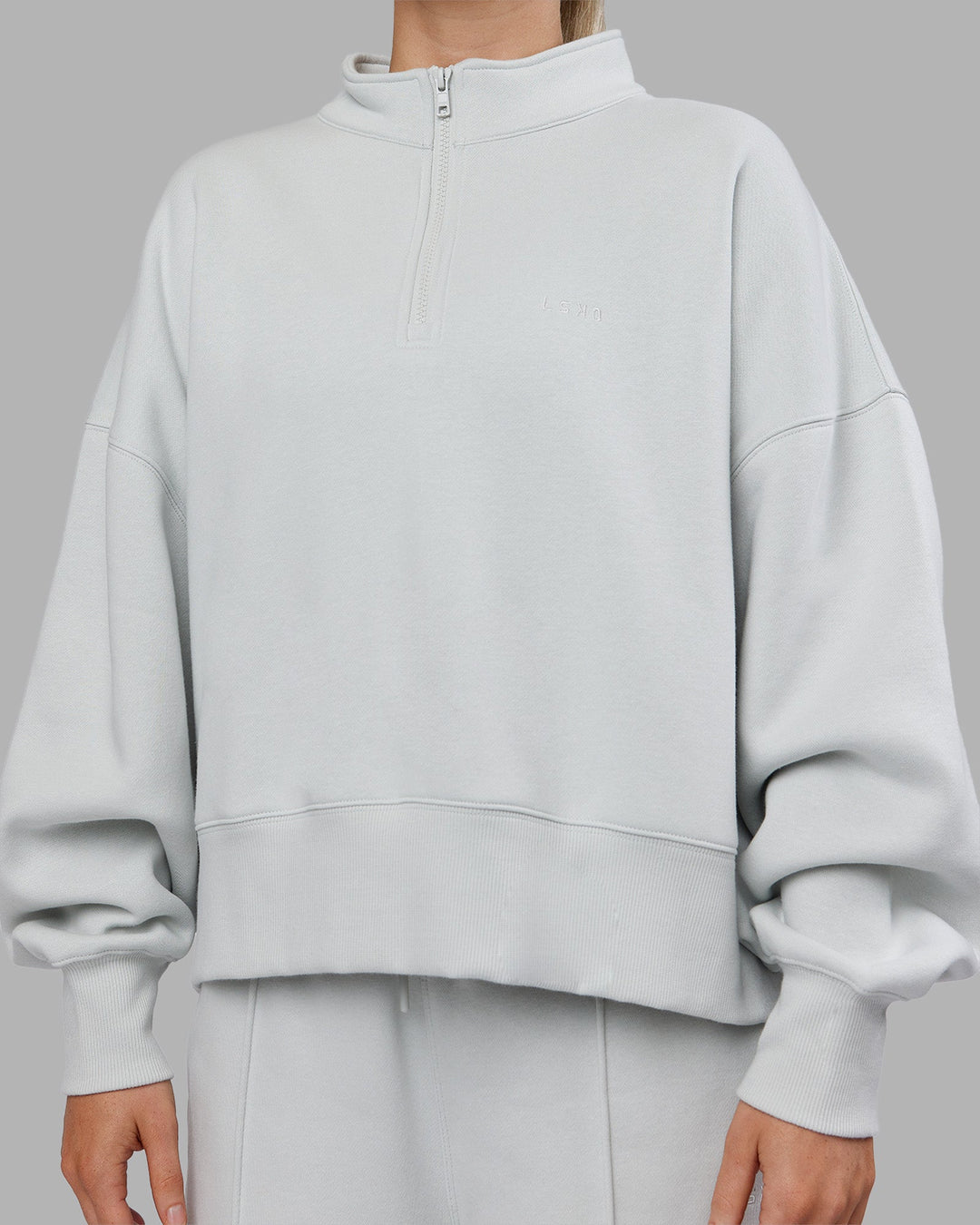 Woman wearing MVP 1/2 Zip Oversized Sweater - Digital Mist | Model:Neve | Size:S