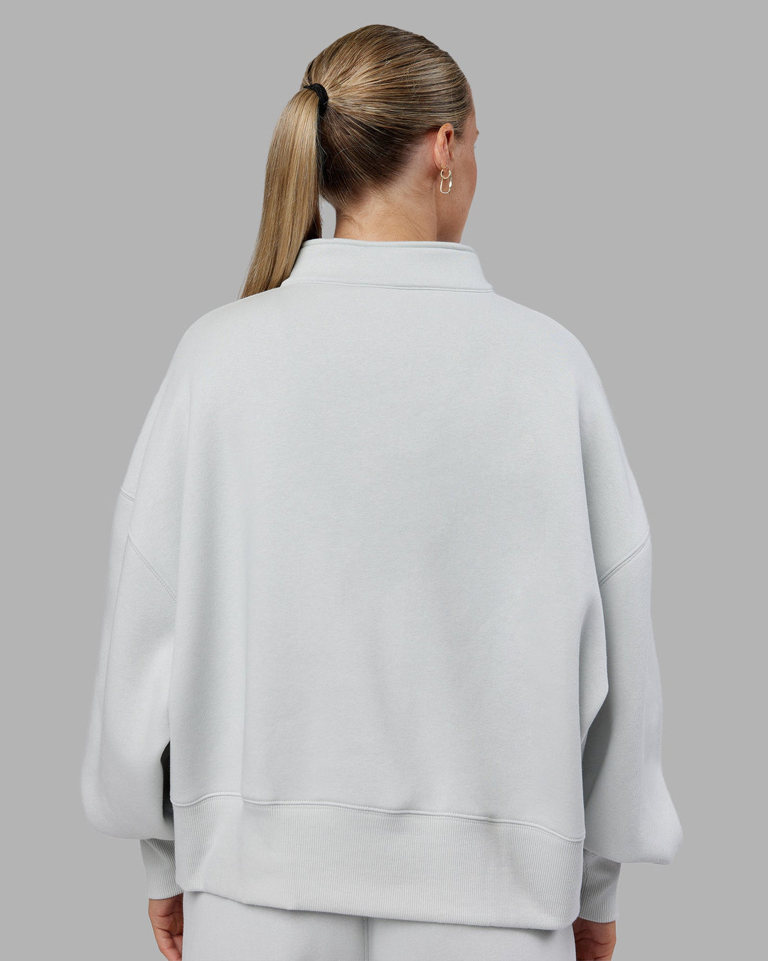 Woman wearing MVP 1/2 Zip Oversized Sweater - Digital Mist | Model:Neve | Size:S