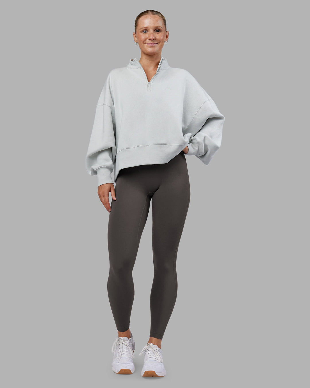 Woman wearing MVP 1/2 Zip Oversized Sweater - Digital Mist | Model:Neve | Size:S