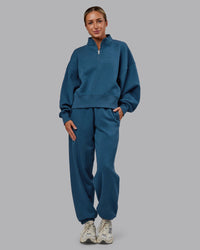 Woman wearing MVP 1/2 Zip Oversized Sweater - Indigo | Model:Paris | Size:S | Thumbnail Index: 0