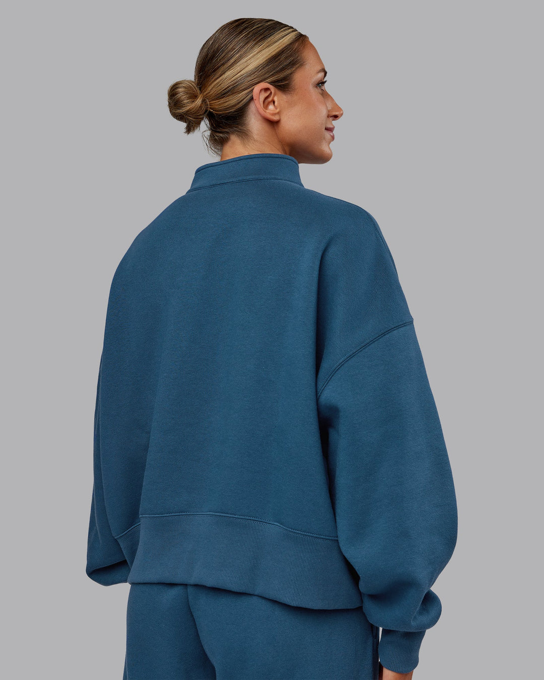 Woman wearing MVP 1/2 Zip Oversized Sweater - Indigo | Model:Paris | Size:S