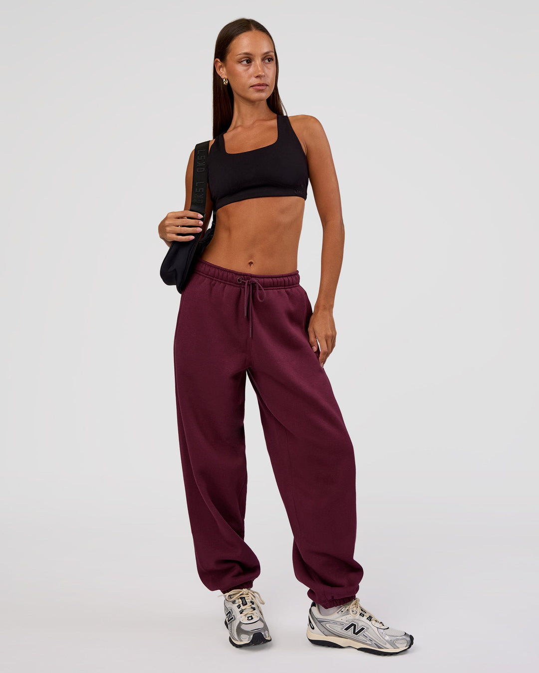 Woman wearing MVP Oversized Slouchy Fit Track Pant - Cherry Lacquer | Model:Brylee | Size:S