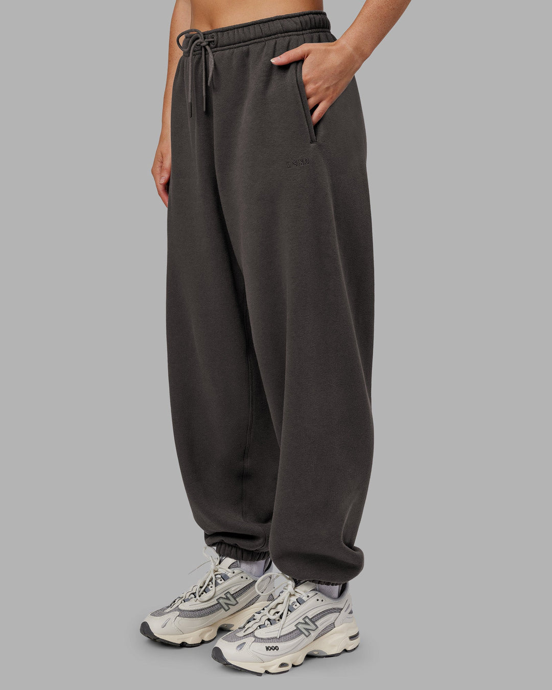 Woman wearing MVP Oversized Slouchy Fit Track Pant - Dark Storm | Model:Neve | Size:S