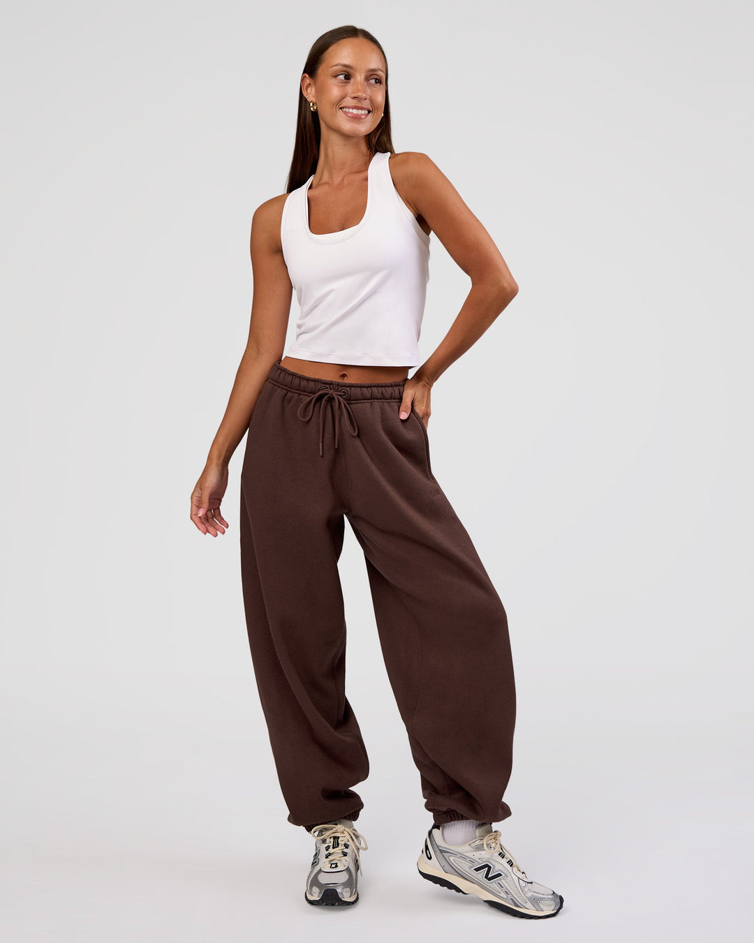 Woman wearing MVP Oversized Slouchy Fit Track Pant - Hot Chocolate | Model:Brylee | Size:S