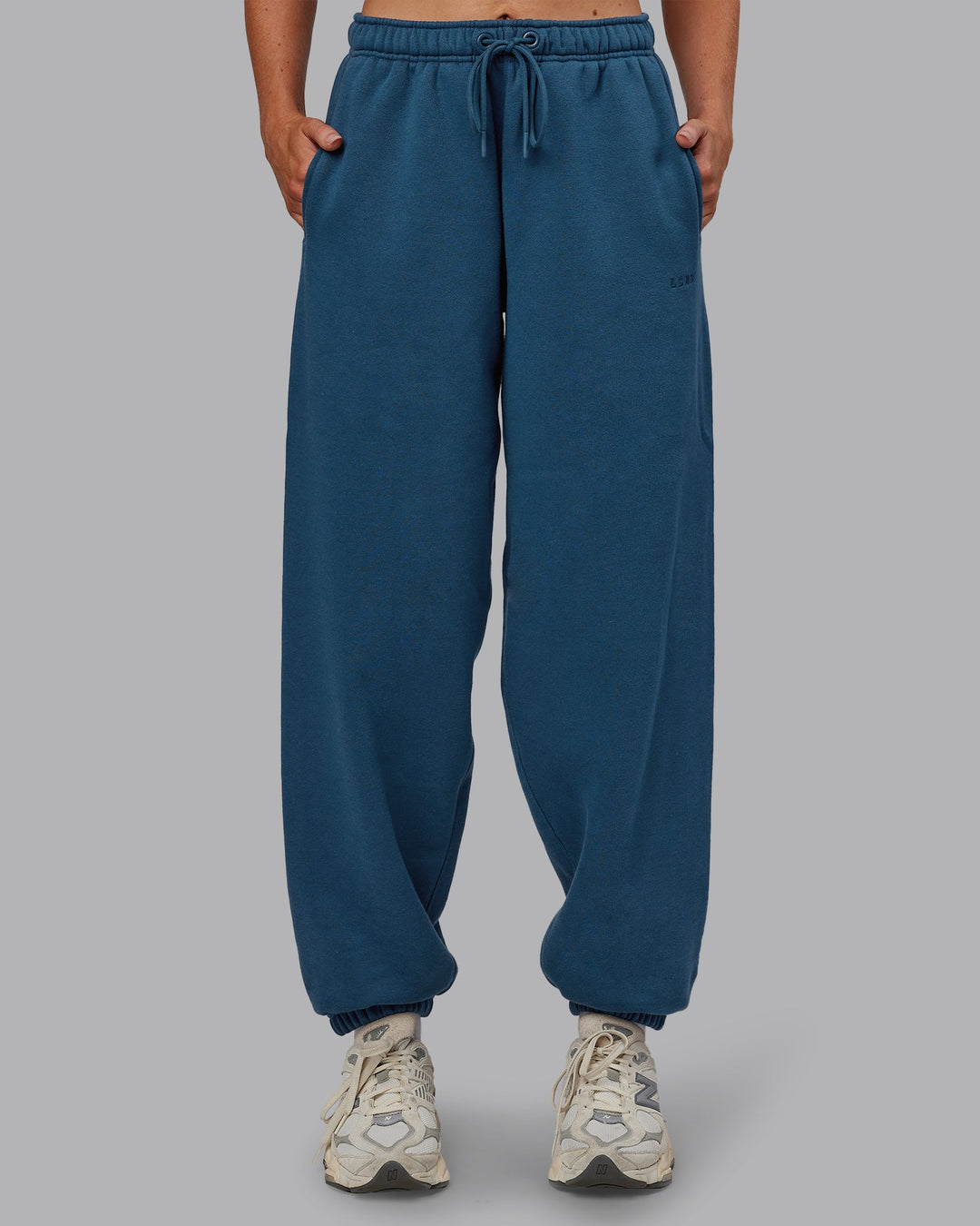 Woman wearing MVP Oversized Slouchy Fit Track Pant - Indigo | Model:Paris | Size:S