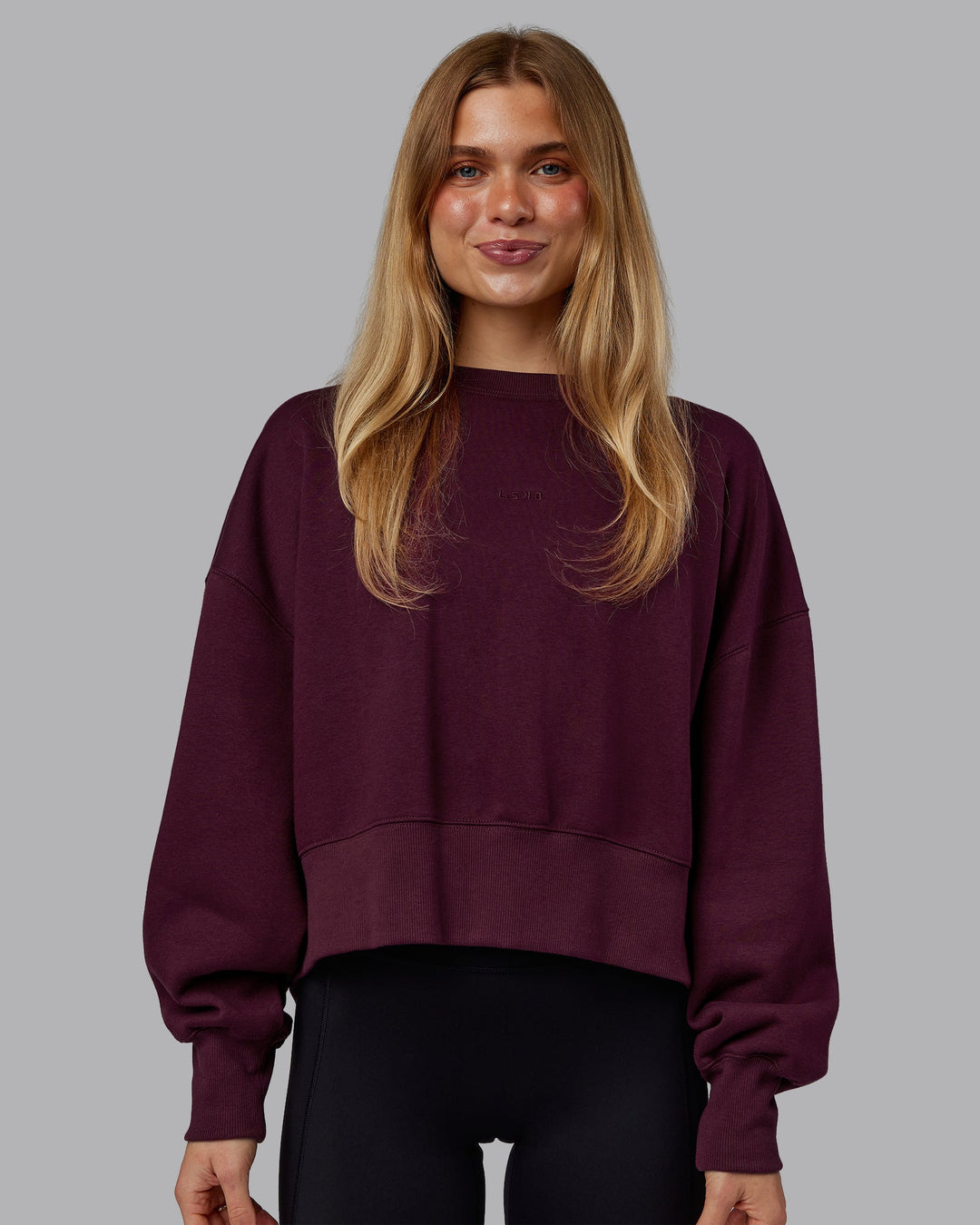 Woman wearing MVP Oversized Sweater - Cherry Lacquer | Model:Emilie | Size:S
