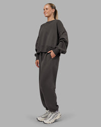 Woman wearing MVP Oversized Sweater - Dark Storm | Model:Neve | Size:S