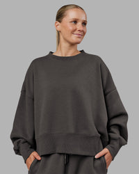 Woman wearing MVP Oversized Sweater - Dark Storm | Model:Neve | Size:S