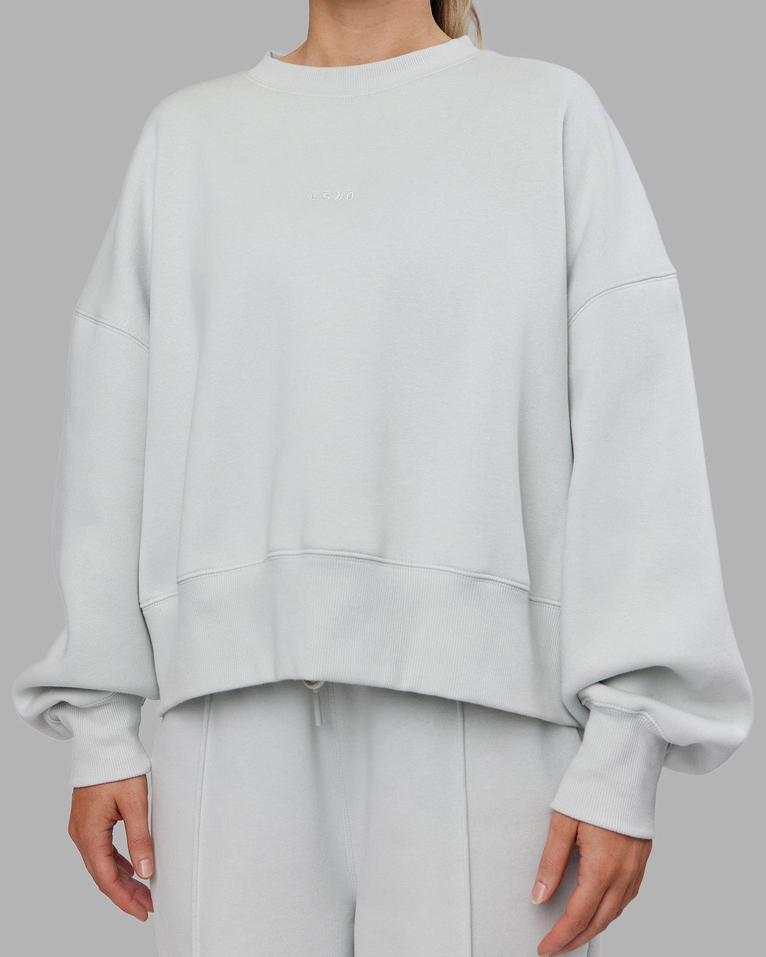 Woman wearing MVP Oversized Sweater - Digital Mist | Model:Neve | Size:S