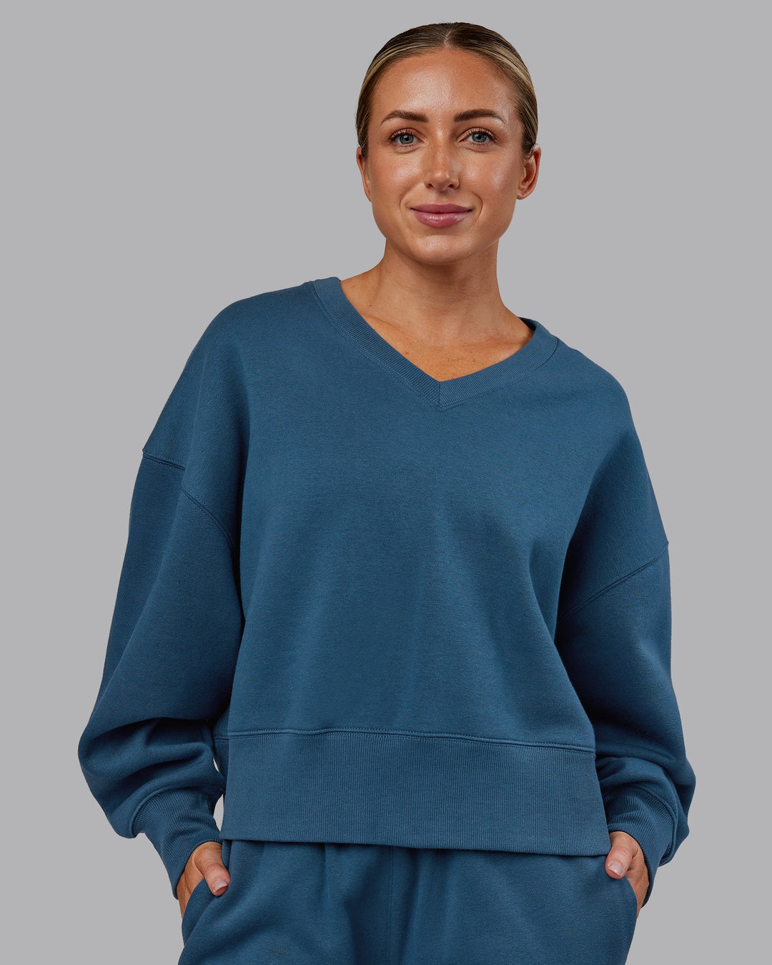 Woman wearing MVP V Neck Oversized Sweater - Indigo | Model:Paris | Size:S