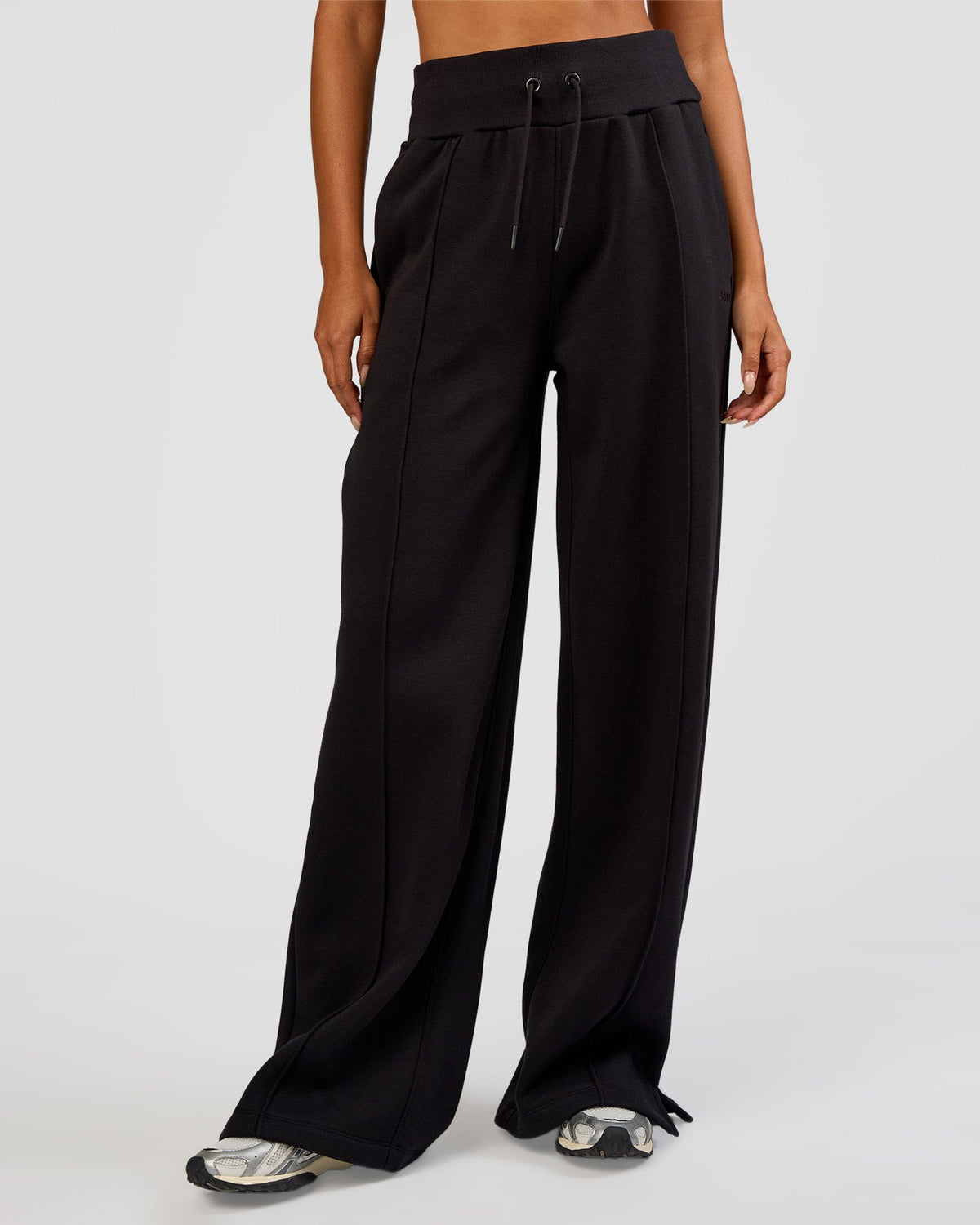 Woman wearing MVP Wide Leg Tall Track Pant - Black | Model:Ruby | Size:S - view 1
