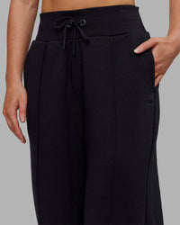 Woman wearing MVP Wide Leg Joggers - Black | Model:Neve | Size:S