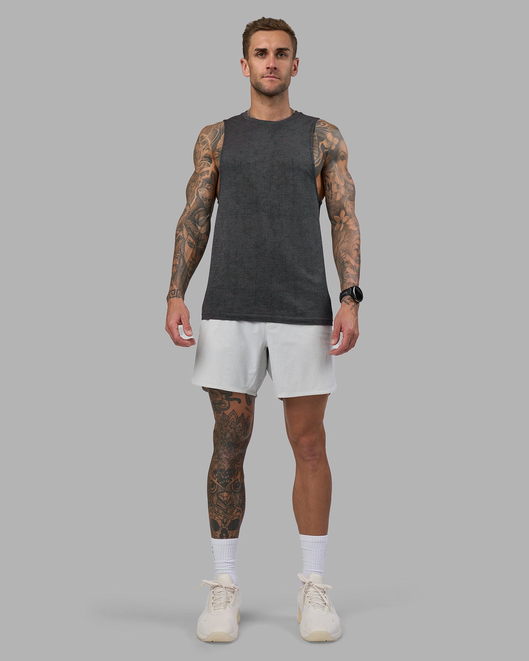 Man wearing AeroFLX+ Seamless Muscle Tank - Black Camo-Graphite | Model:Tommy | Size:S