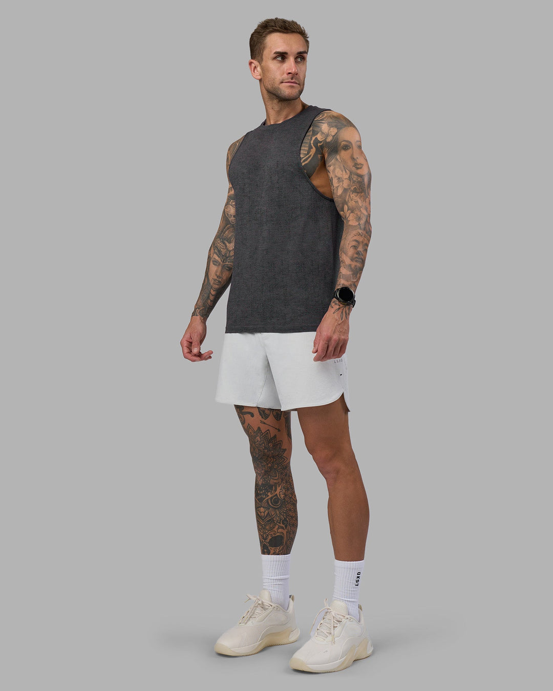 Man wearing AeroFLX+ Seamless Muscle Tank - Black Camo-Graphite | Model:Tommy | Size:S