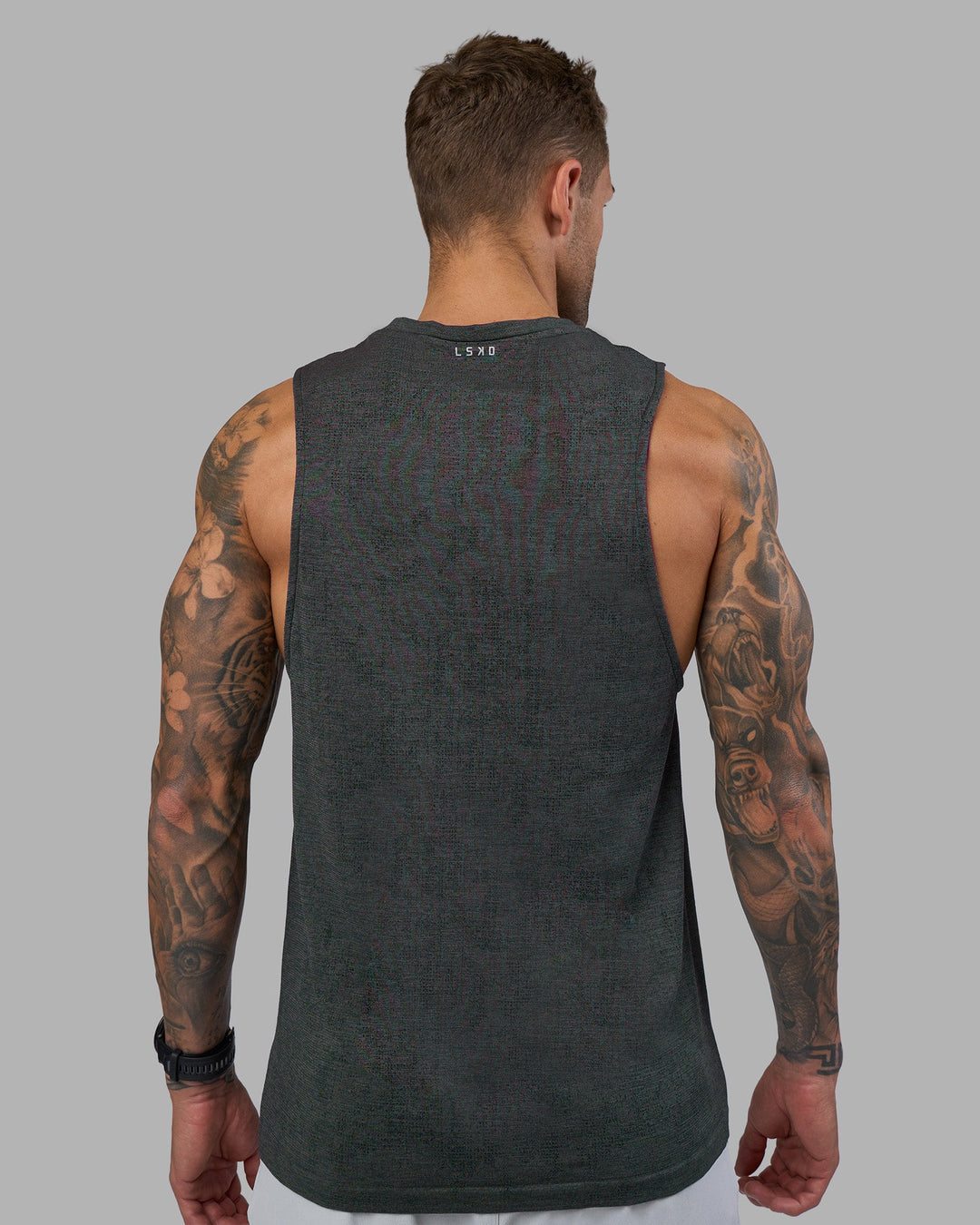 Man wearing AeroFLX+ Seamless Muscle Tank - Black Camo-Graphite | Model:Tommy | Size:S