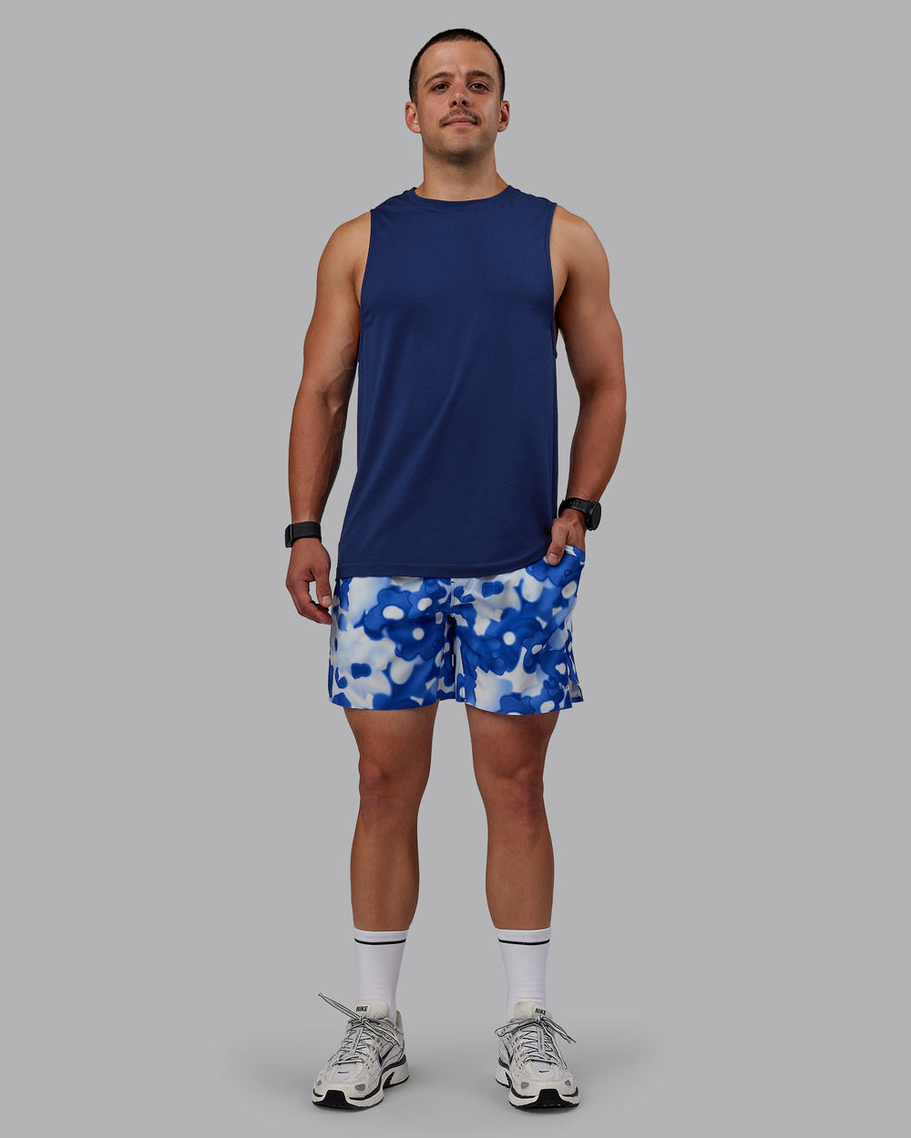 Man wearing AeroFLX+ Seamless Muscle Tank - Midnight Blue/Midnight Blue Marl