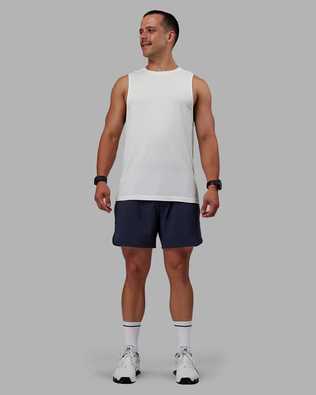 Man wearing AeroFLX+ Seamless Muscle Tank - Off White/Off White Marl